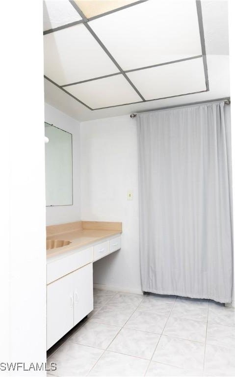 bathroom with vanity and tile patterned flooring