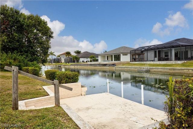 dock area with a lanai and a water view