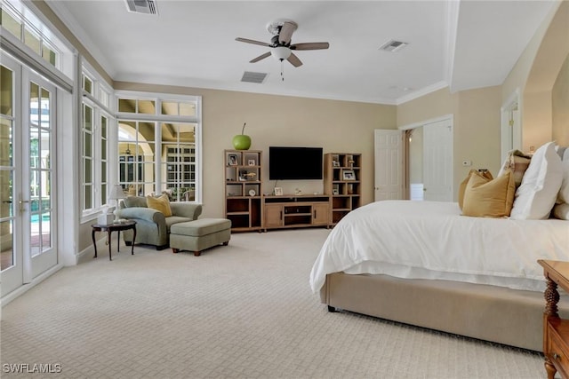 bedroom featuring ceiling fan, access to exterior, light colored carpet, and french doors