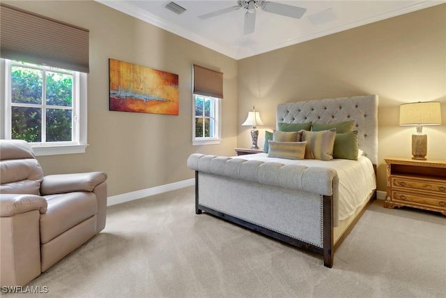 carpeted bedroom featuring multiple windows, ceiling fan, and crown molding