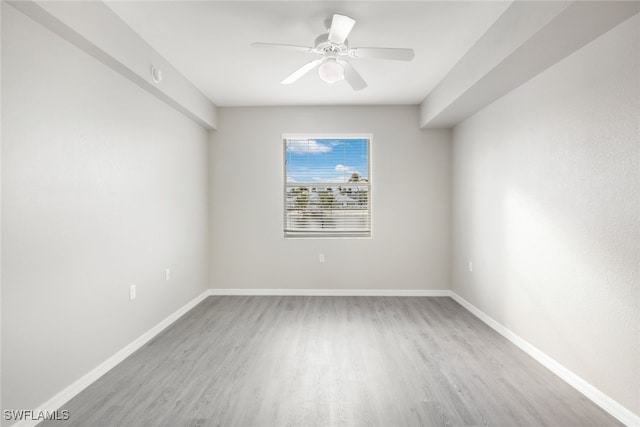 unfurnished room featuring ceiling fan and light wood-type flooring