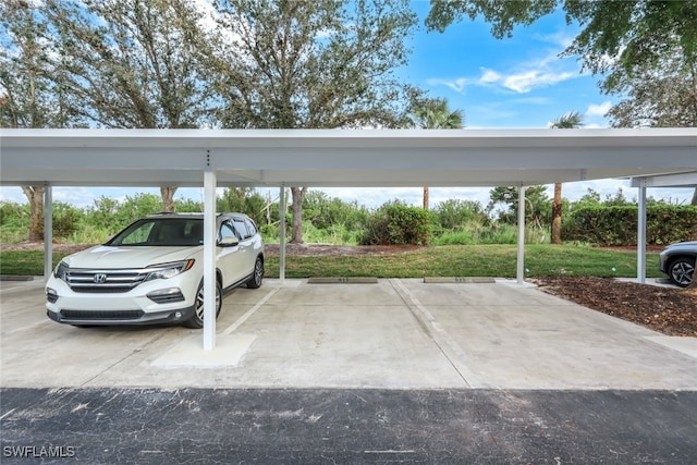 view of vehicle parking with a carport