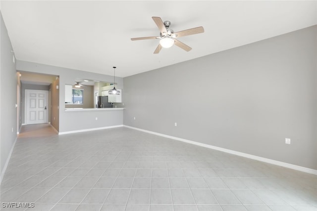 unfurnished living room with ceiling fan