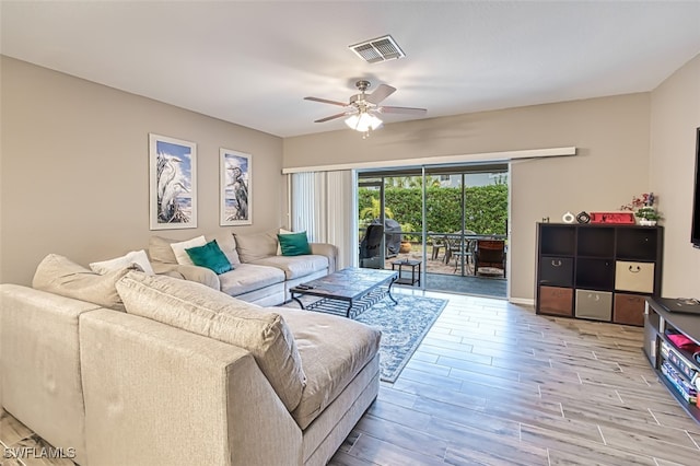 living room featuring ceiling fan