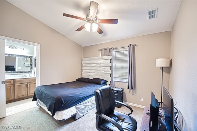 carpeted bedroom with ceiling fan and connected bathroom