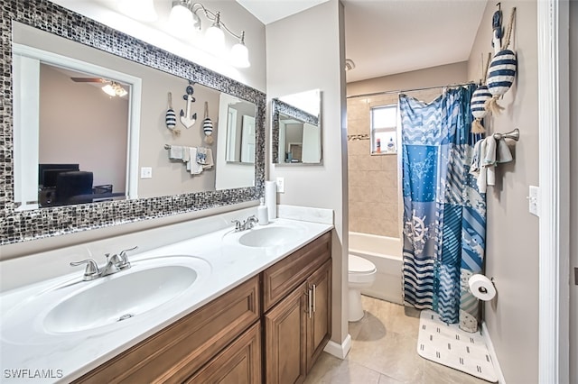 full bathroom with tile patterned floors, toilet, vanity, and shower / tub combo with curtain