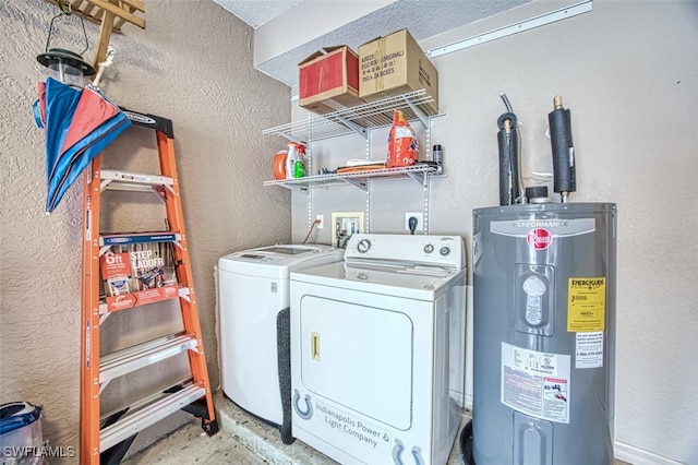 washroom featuring washing machine and dryer and electric water heater