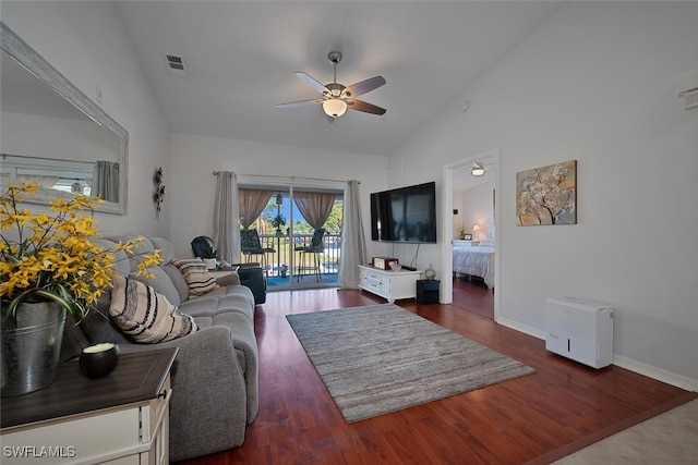 living room featuring ceiling fan, dark hardwood / wood-style flooring, and high vaulted ceiling