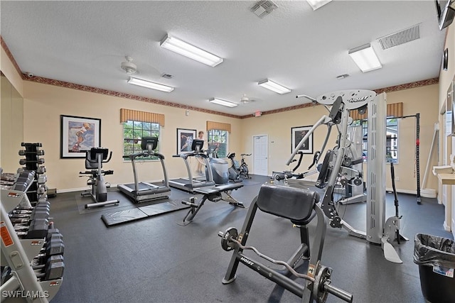 workout area featuring a textured ceiling