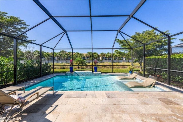 view of pool with a lanai and a patio area