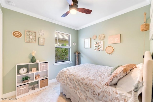 bedroom with ceiling fan, light tile patterned floors, and ornamental molding