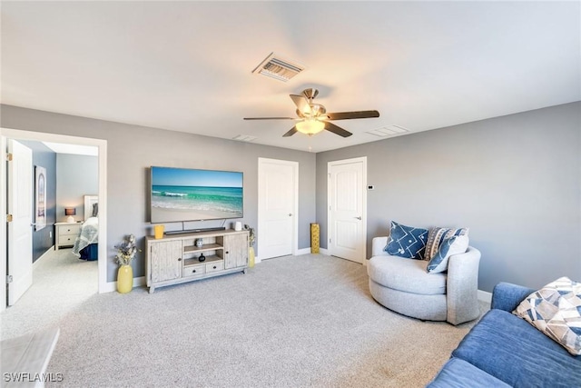 living room with light colored carpet and ceiling fan