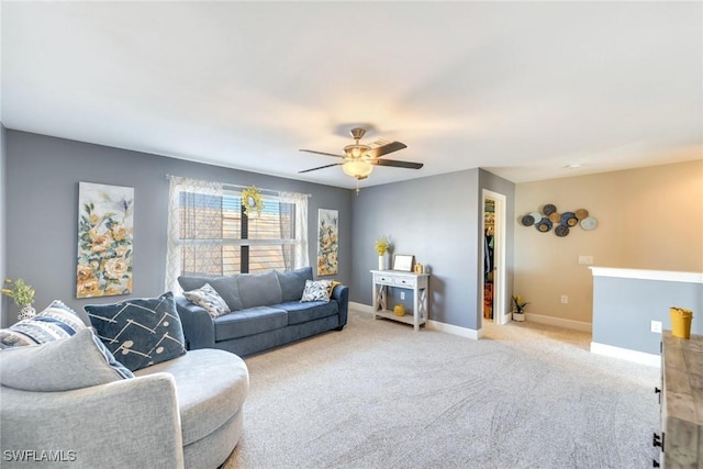 carpeted living room featuring ceiling fan