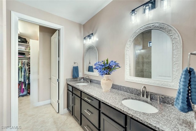 bathroom with tile patterned flooring and vanity