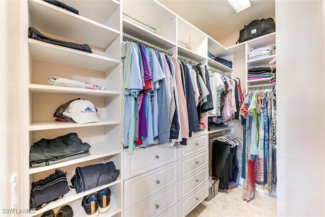 walk in closet featuring light tile patterned floors