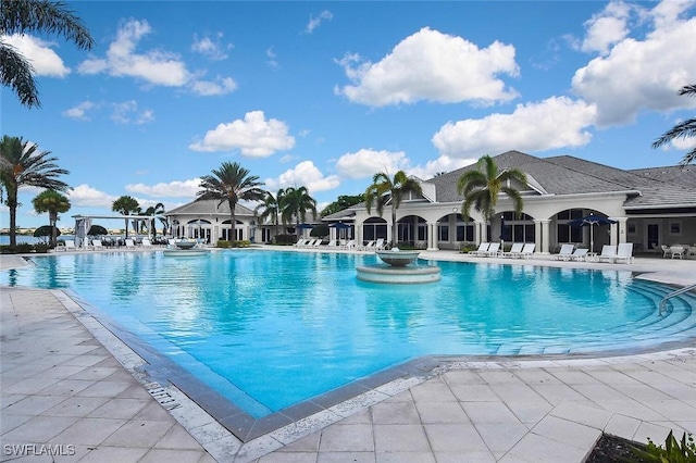 view of swimming pool featuring a patio area