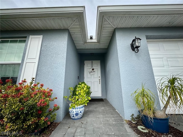 property entrance with a garage