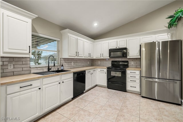 kitchen featuring white cabinets, sink, vaulted ceiling, and black appliances