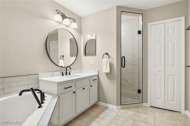 bathroom featuring tile patterned floors, vanity, and independent shower and bath