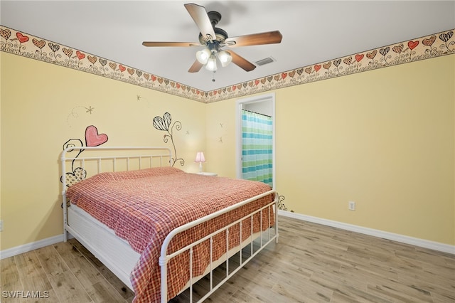 bedroom featuring light hardwood / wood-style floors and ceiling fan