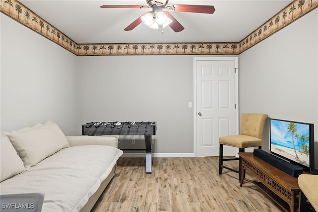 sitting room featuring ceiling fan and hardwood / wood-style flooring