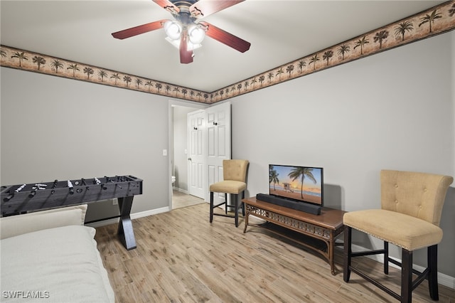 recreation room with light hardwood / wood-style flooring and ceiling fan