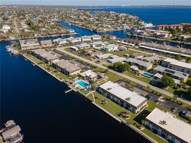 birds eye view of property featuring a water view and a residential view