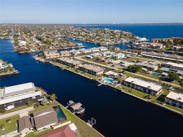 birds eye view of property featuring a water view and a residential view