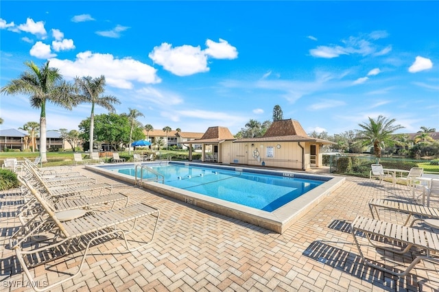 view of swimming pool with a patio area