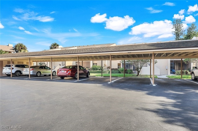 view of parking / parking lot with a carport