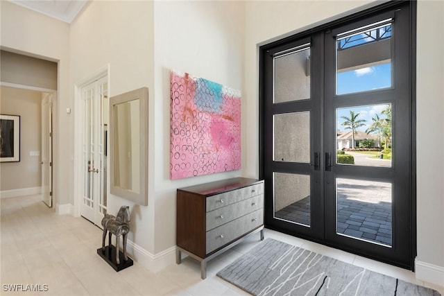 doorway to outside featuring french doors and light tile patterned floors