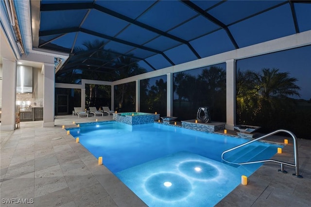 view of swimming pool featuring a lanai, a patio area, and an in ground hot tub