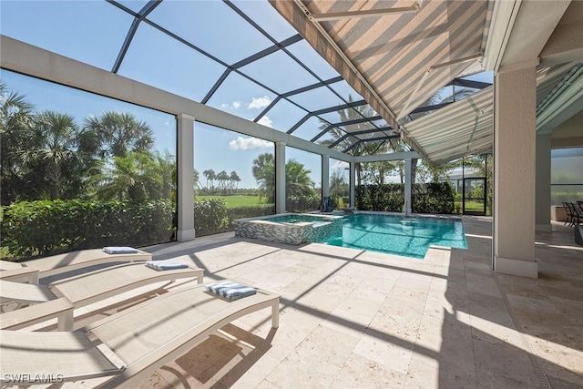 view of swimming pool featuring a lanai, an in ground hot tub, and a patio