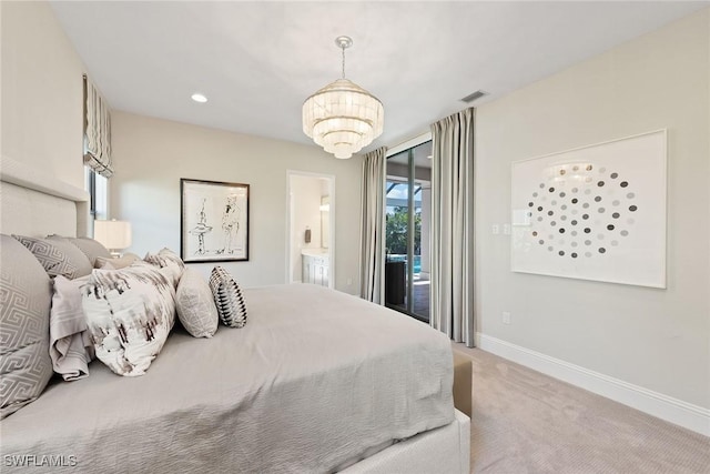 carpeted bedroom featuring access to exterior and an inviting chandelier