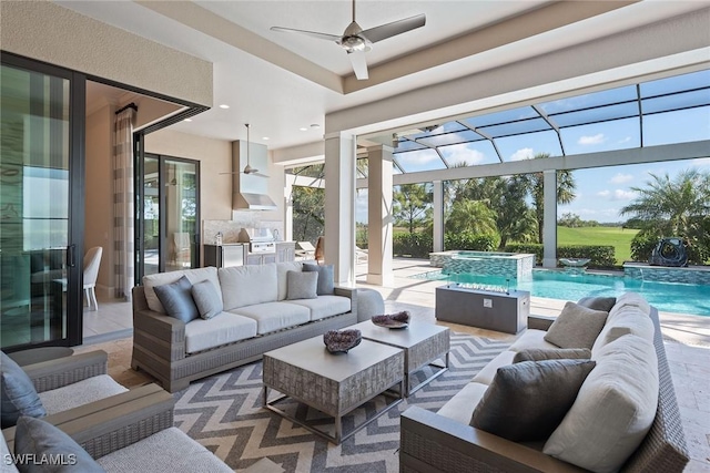 sunroom featuring ceiling fan