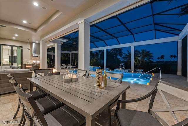 view of patio / terrace with pool water feature, an outdoor living space, and glass enclosure