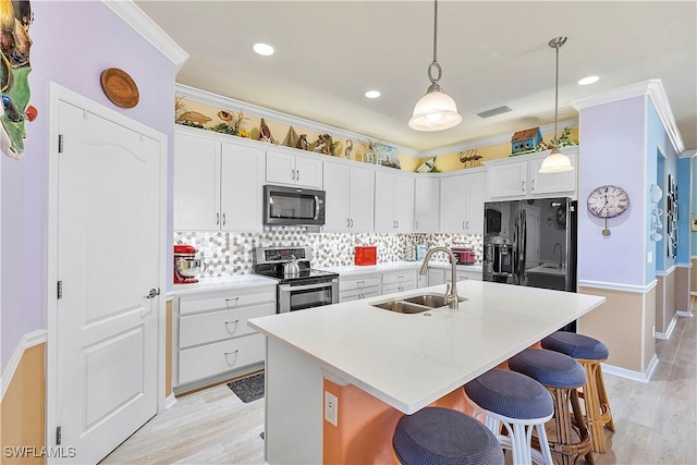 kitchen with stainless steel electric range, a center island with sink, white cabinets, sink, and black fridge with ice dispenser