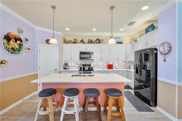 kitchen with white cabinetry, backsplash, black refrigerator with ice dispenser, and hanging light fixtures