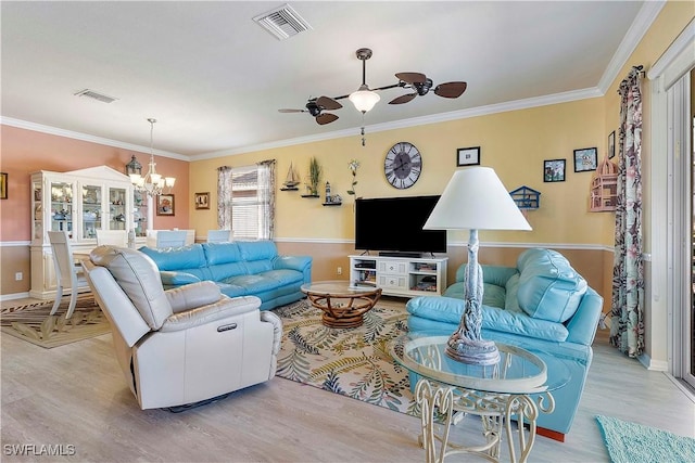 living room with light wood-type flooring and ornamental molding