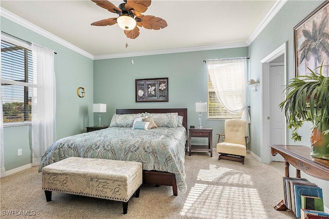 bedroom featuring ceiling fan, crown molding, and light carpet