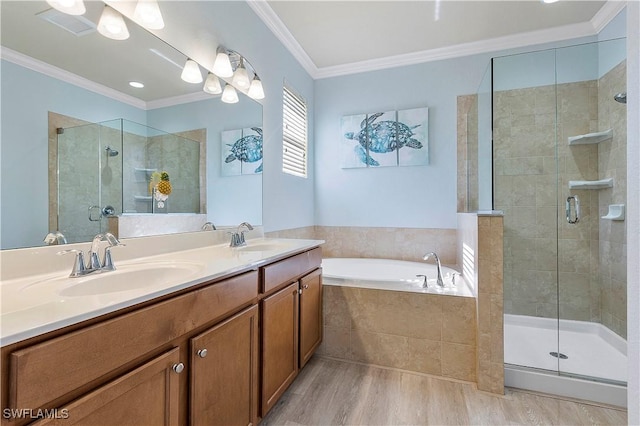 bathroom featuring hardwood / wood-style floors, vanity, separate shower and tub, and crown molding