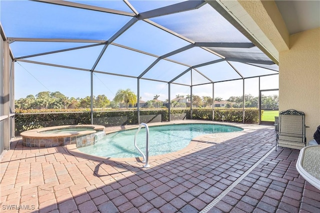 view of pool featuring a patio area, a lanai, and an in ground hot tub