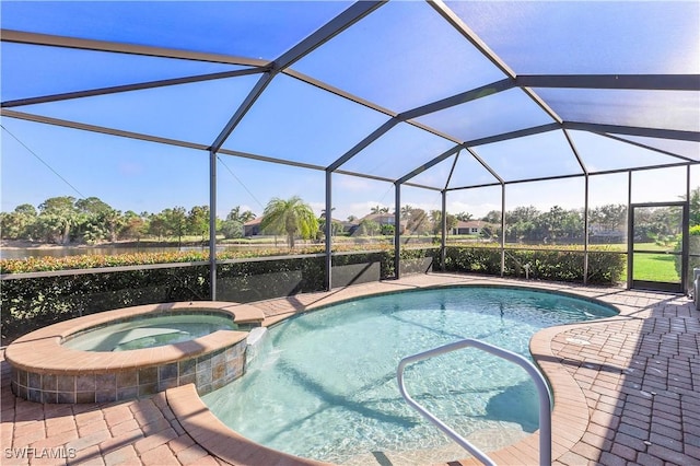 view of swimming pool with an in ground hot tub, glass enclosure, and a patio area