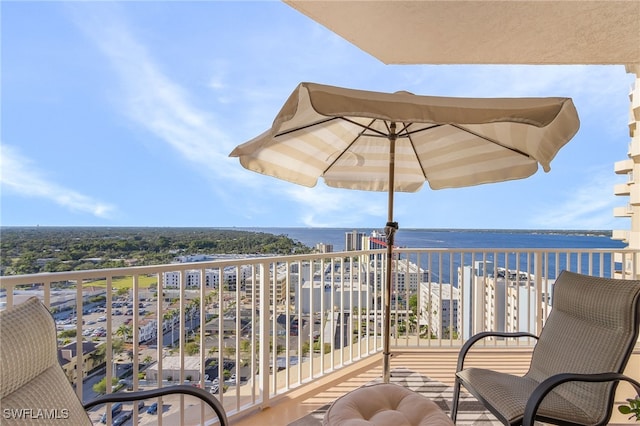 balcony featuring a water view