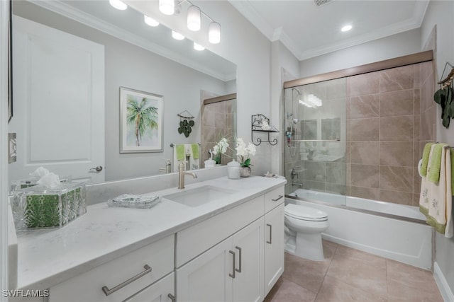 bathroom featuring toilet, ornamental molding, tile patterned flooring, combined bath / shower with glass door, and vanity