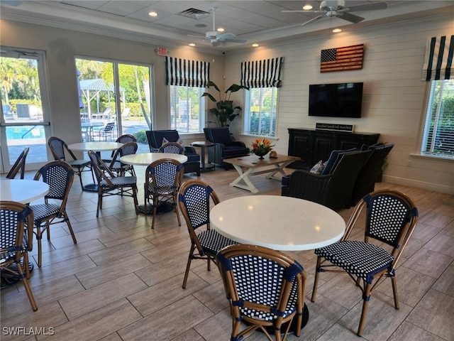 dining room featuring ceiling fan, visible vents, and wood finish floors