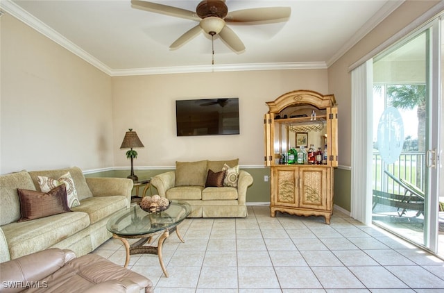 tiled living room with ceiling fan and ornamental molding