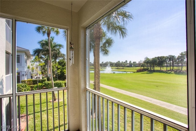 unfurnished sunroom with a water view