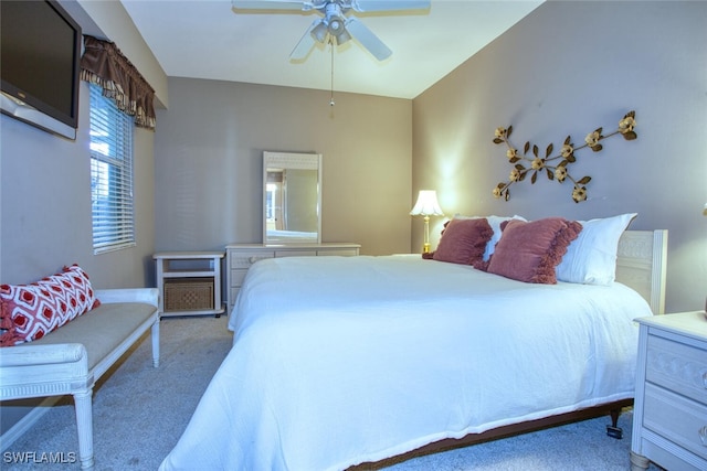 bedroom with ceiling fan and carpet