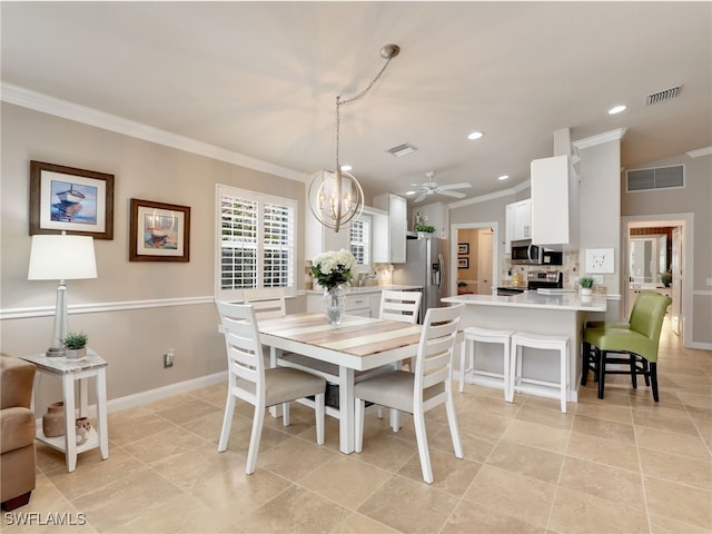 dining space featuring recessed lighting, visible vents, and crown molding